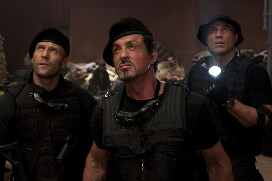 Lee Christmas (Jason Statham, left), Barney Ross (Sylvester Stallone, center) and Toll Road (Randy Couture, right) in THE EXPENDABLES. Photo credit: Karen Ballard