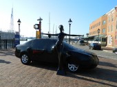 In honor of the 162nd anniversary of Edgar Allan Poe’s death today, October 7, 2011, and in support the upcoming release of Relativity Media’s THE RAVEN on March 9, 2012, black-wrapped cars, mannequins, and trash cans with “RIP EAP” emblazoned on them appeared in the Fells Point section of Baltimore, Maryland.